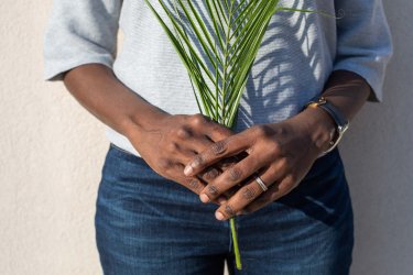 person holding a palm fran at the wellory apartments in huntsville alabama